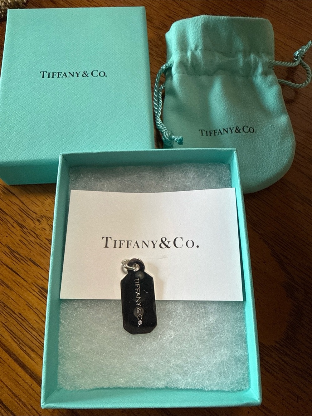 New Tiffany & Co. Luggage Tag Charm with genuine diamond.